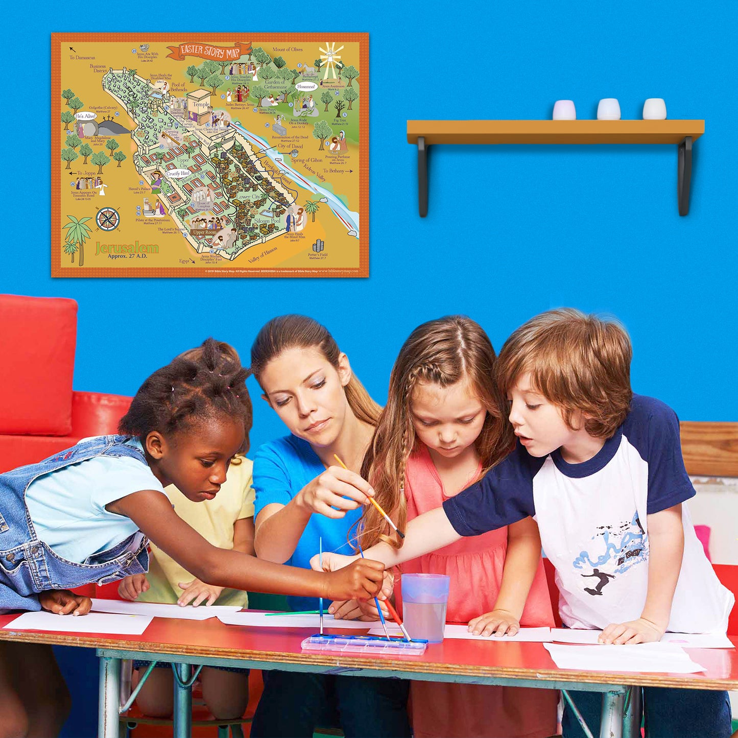 The Easter Story Map Poster in a classroom with children and a teacher